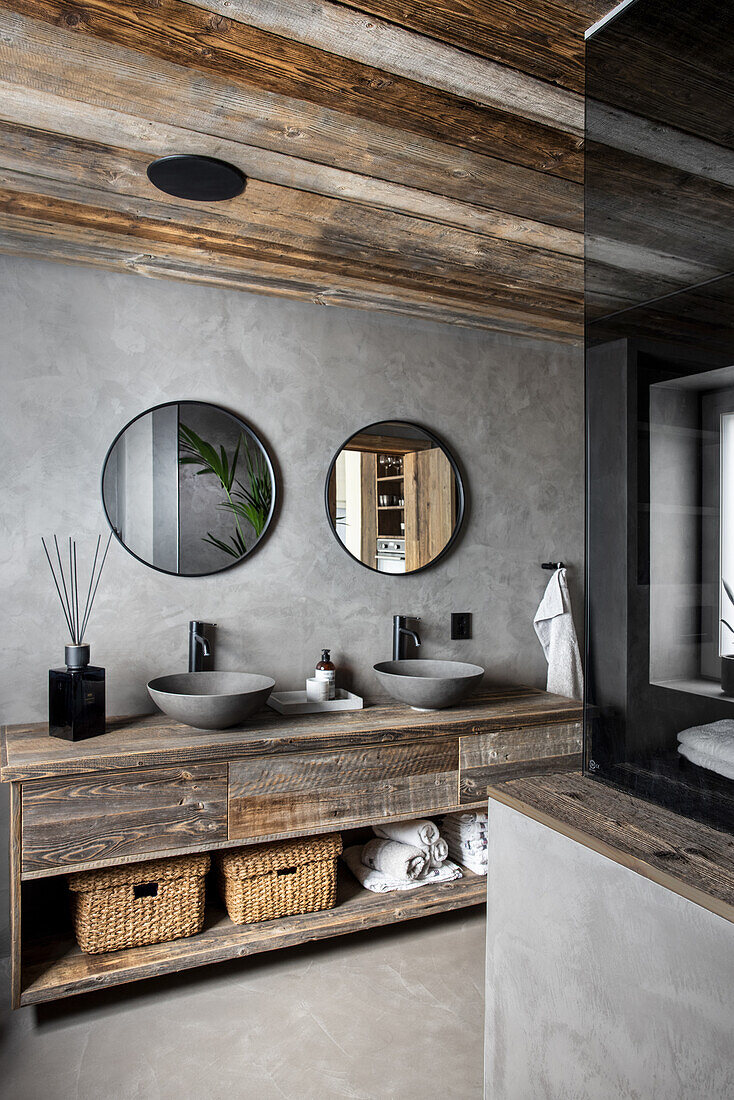 Recycled wood washbasin with two counter tops in the bathroom with grey walls