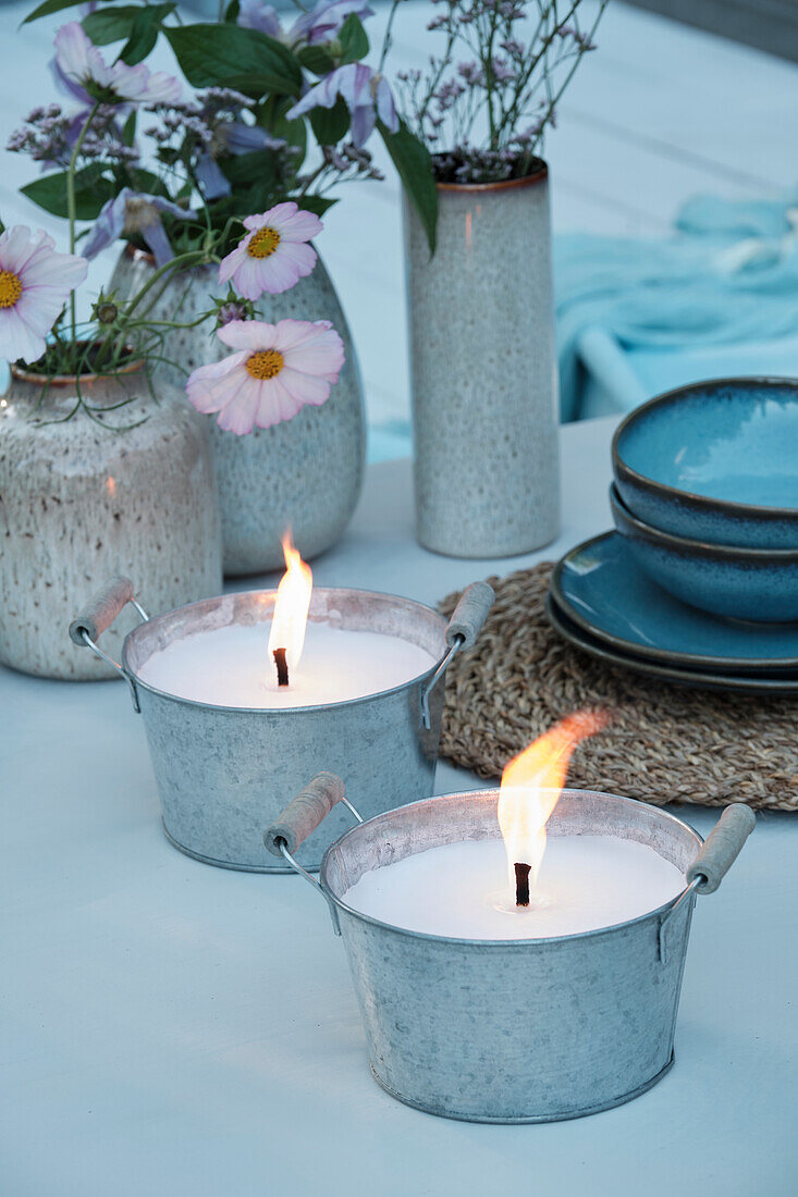 Candles in zinc containers