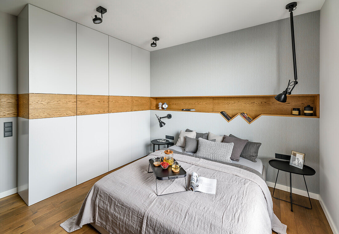 Tray on Queen bed, light grey wardrobes with oak inlay