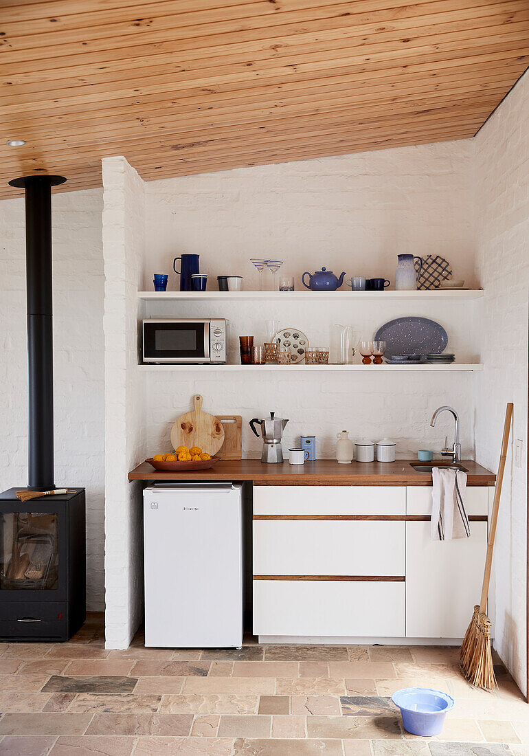 Small kitchenette, next to a wood-burning stove