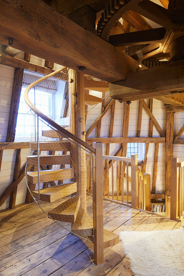 Solid wood spiral staircase in converted windmill