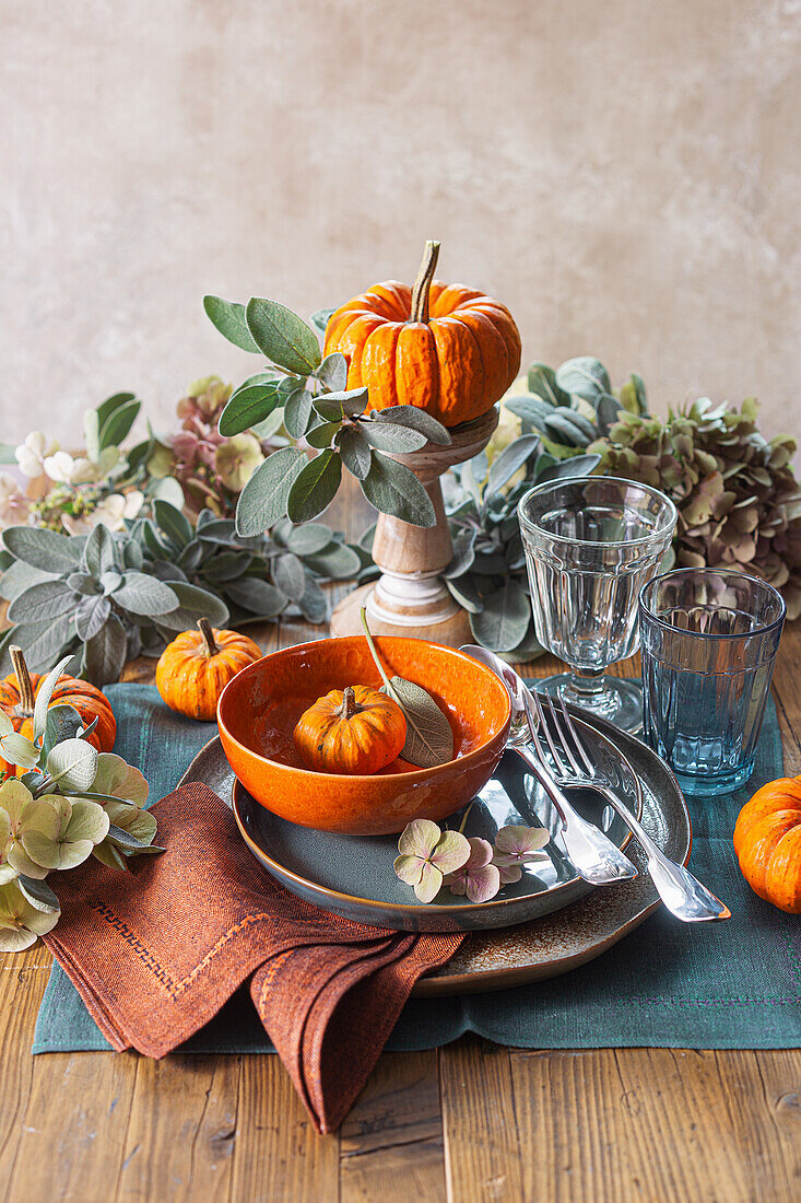 Autumn table decoration with pumpkins