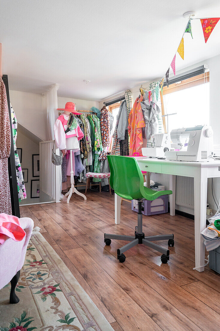 Study with sewing machine, colourful clothes and bunting