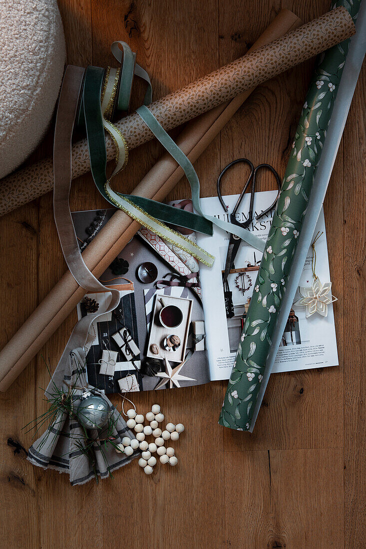 Wrapping materials for gifts on wooden floor