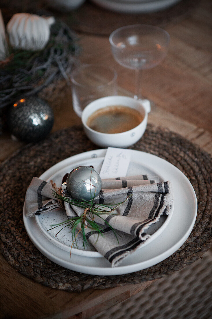 Festive table setting with coffee cup and Christmas decorations