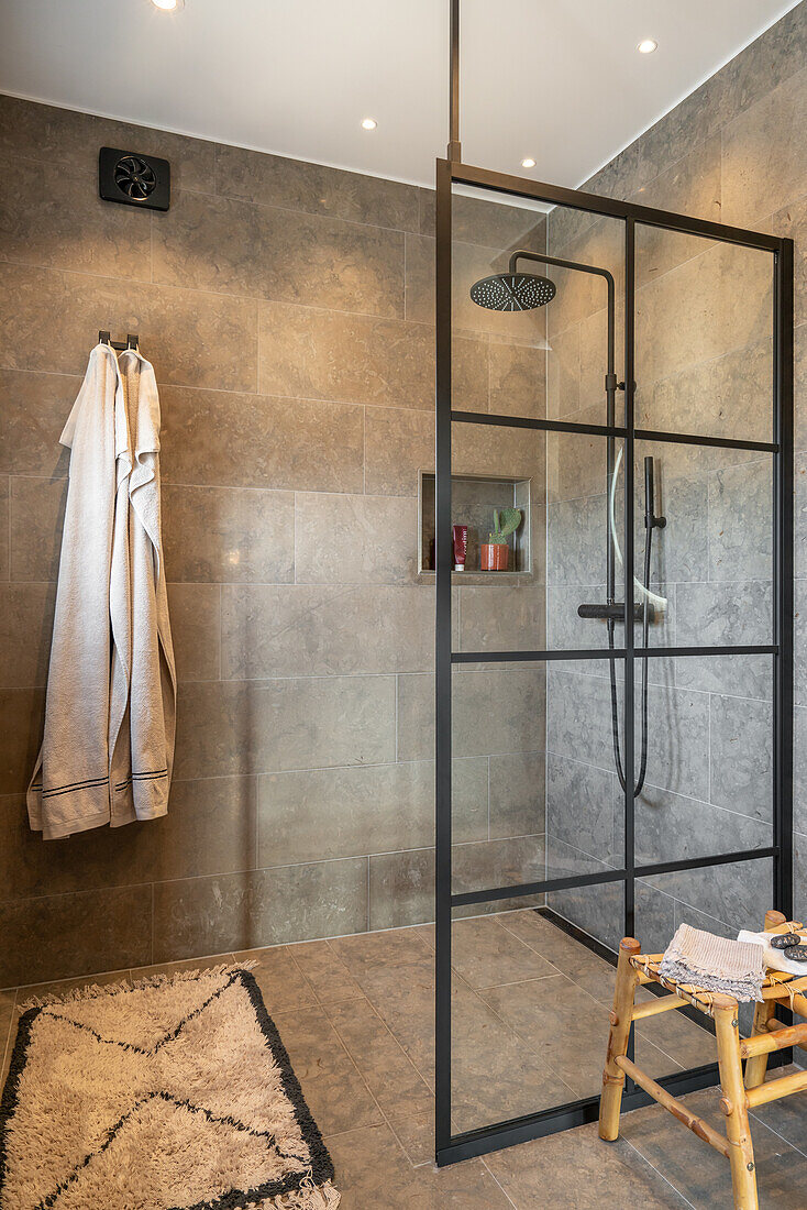 Modern shower cubicle with glass walls in the bathroom