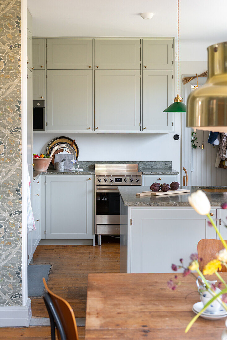 Scandi style kitchen with pendant lights and wooden floor