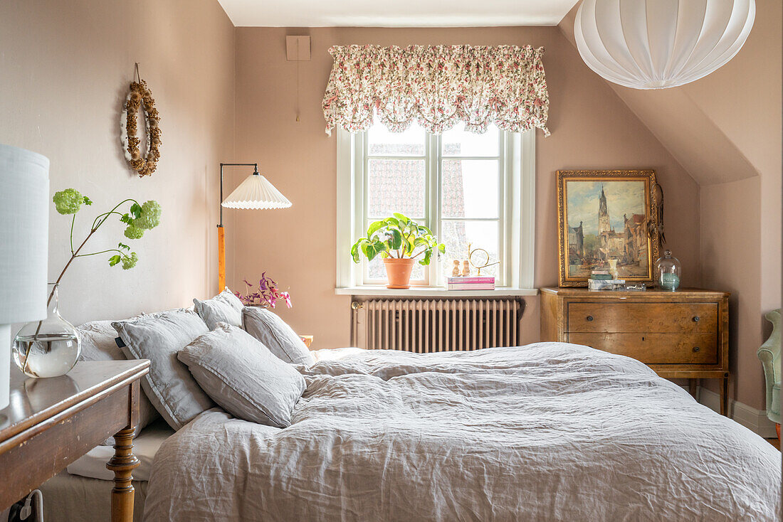 Bedroom with vintage furniture and beige walls