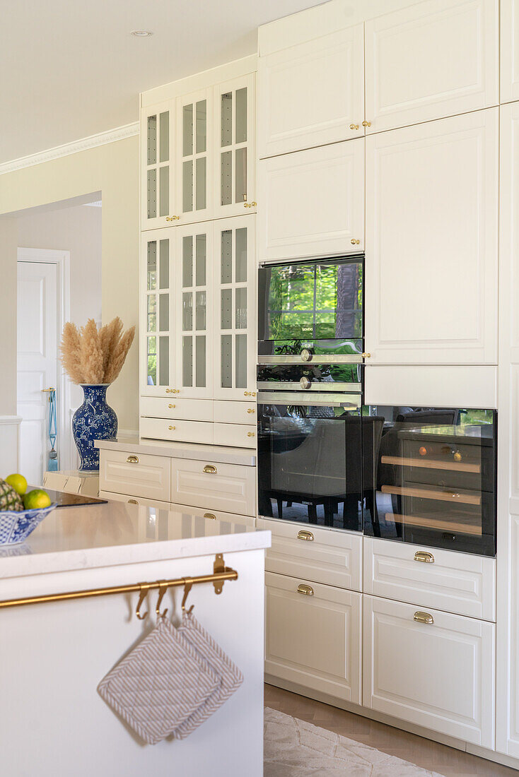 White kitchen with integrated wine fridge