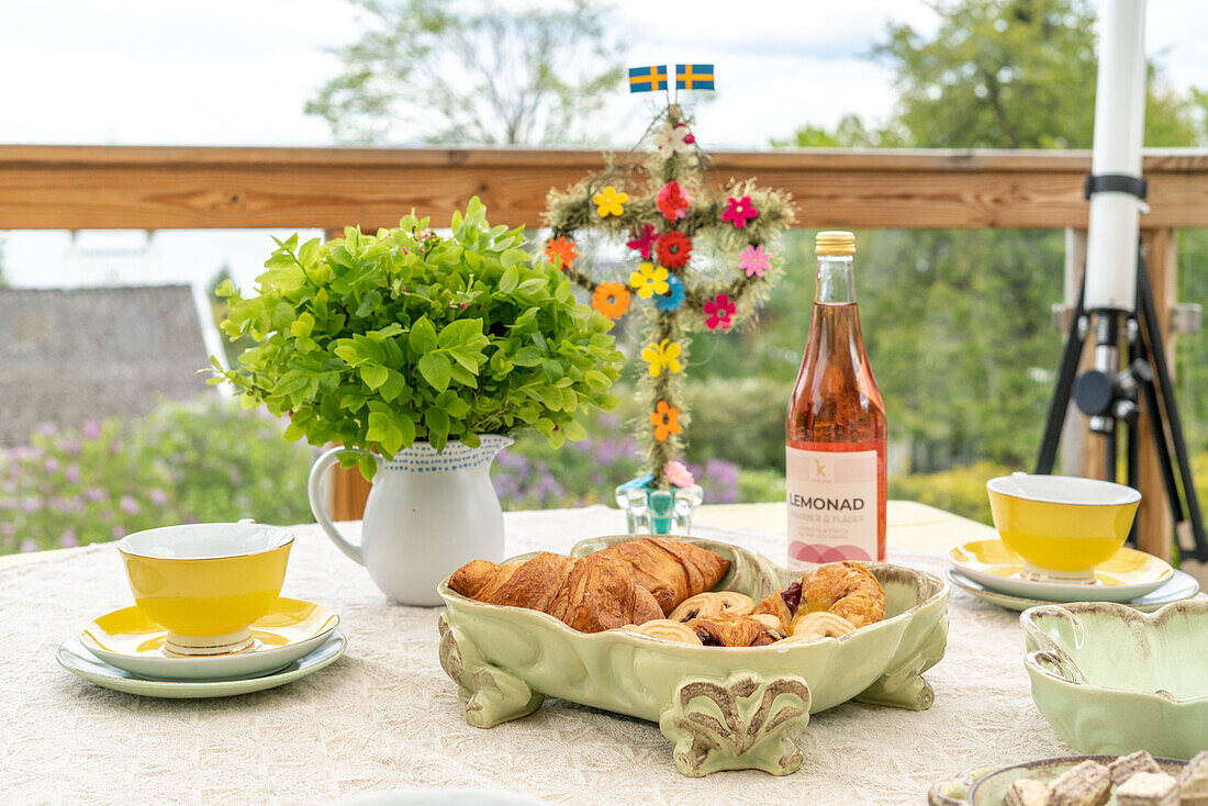 Outdoor table setting with pastries and lemonade