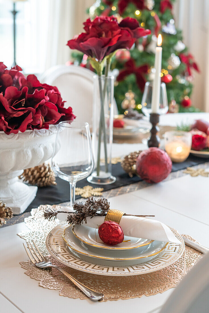 Festively set dining table with classic Christmas decorations