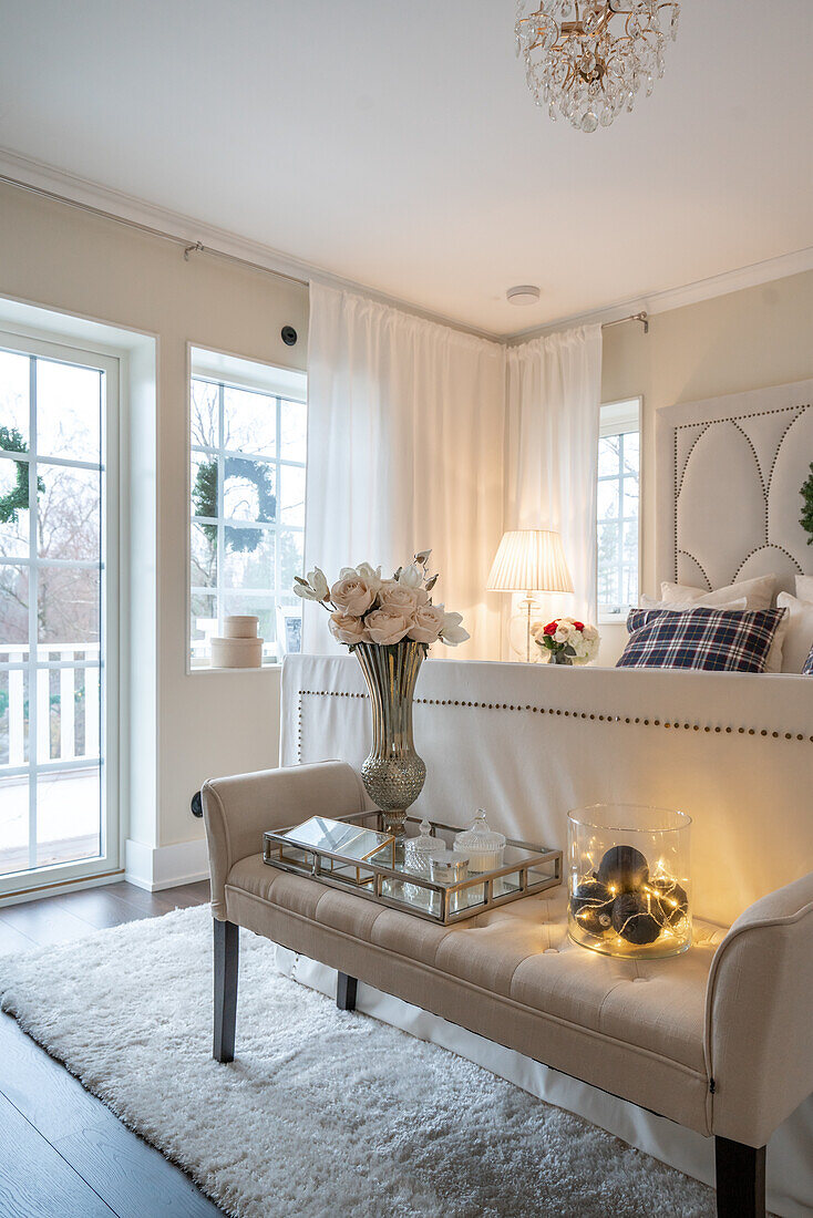 Brightly decorated bedroom with bed bench and decorative accessories