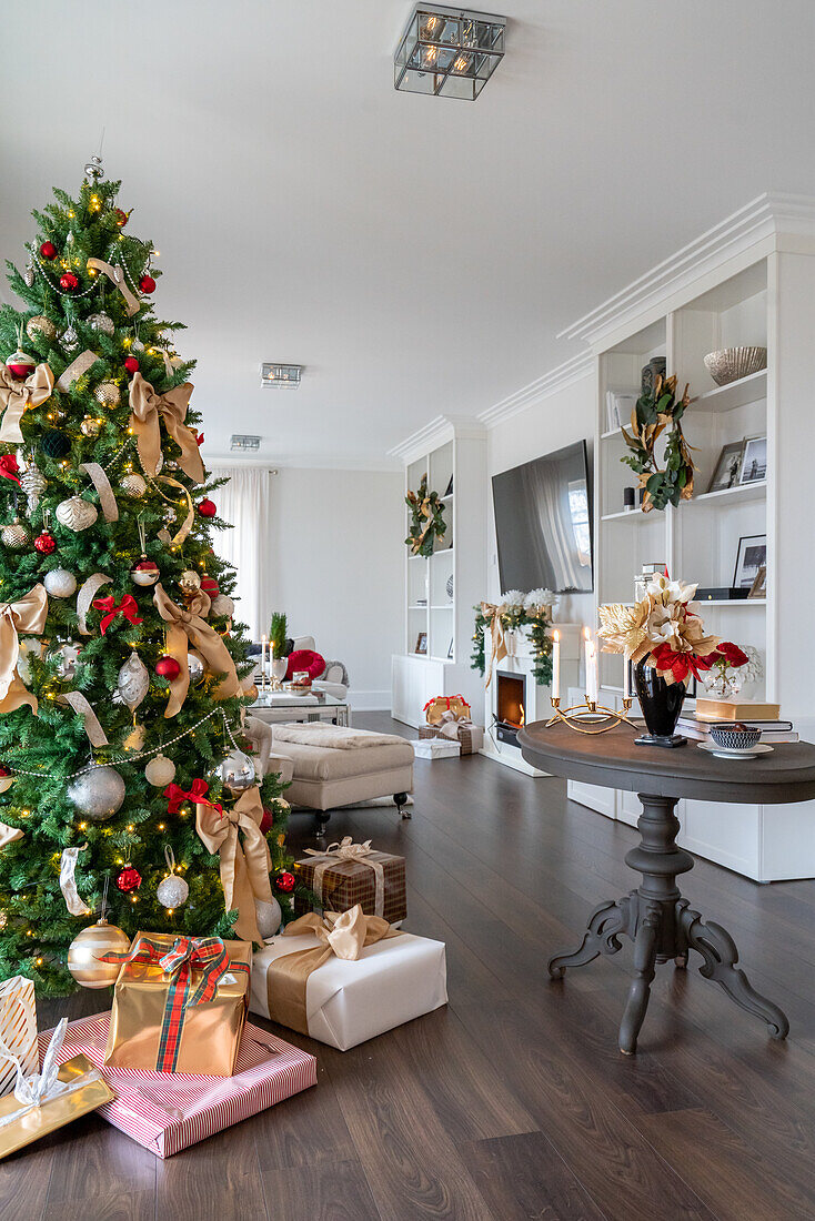 Living room decorated for Christmas with Christmas tree and presents