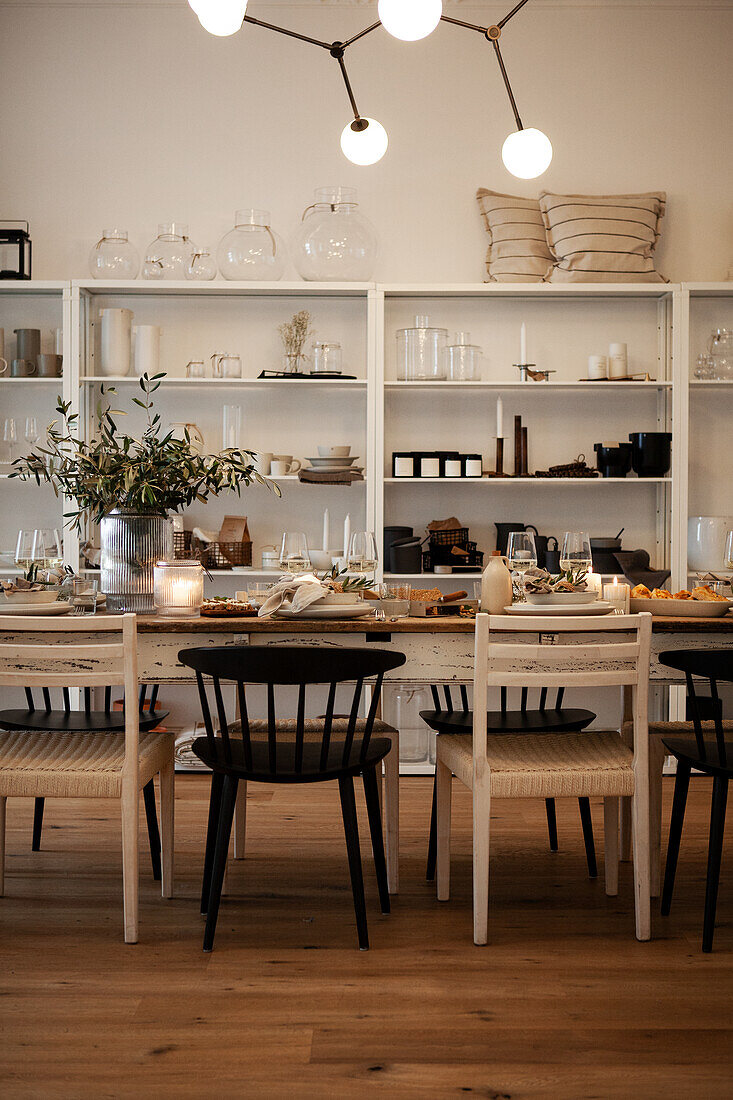 Dining room with open shelves and candles on the table