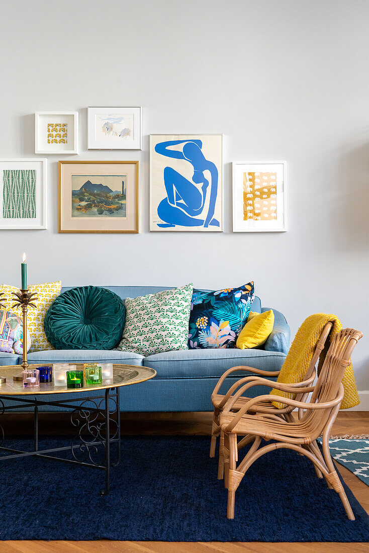 Living room with colourful cushions and modern picture wall