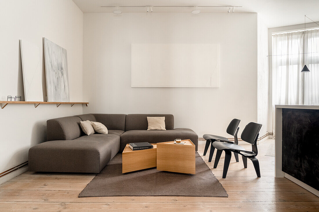 Minimalist living room with corner sofa and wooden furniture