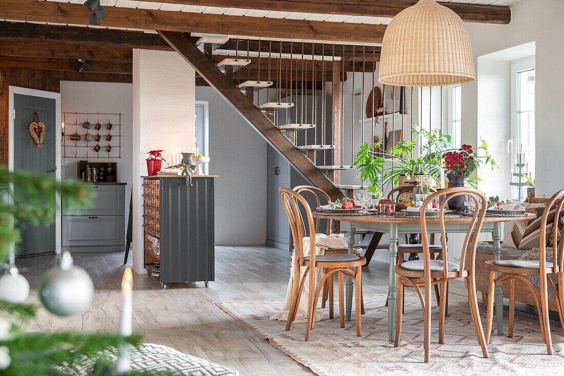 Country-style dining room with wooden furniture and exposed ceiling beams