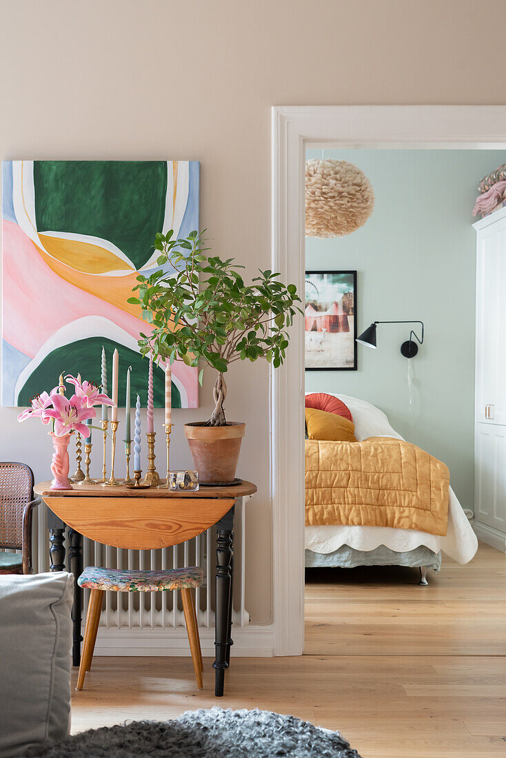 View from the colourful living room into the colourful bedroom