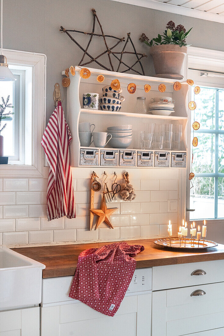 Country-style kitchen with open shelves and decorations