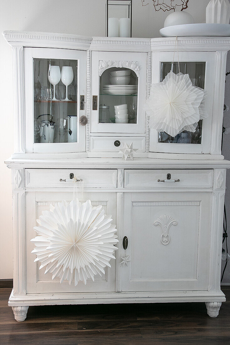 Sideboard decorated with filigree DIY paper stars