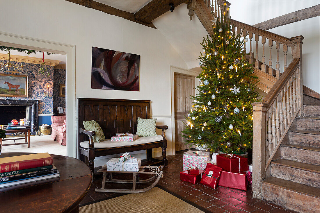 Living room decorated for Christmas with Christmas tree and presents