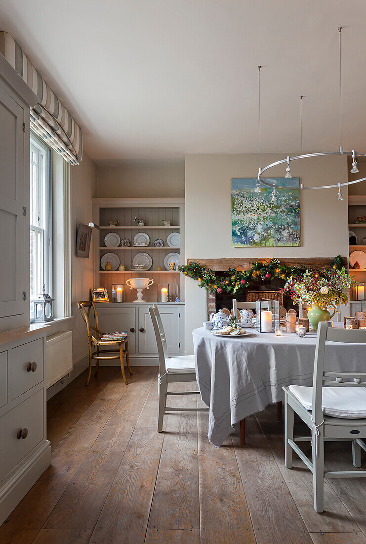 Dining room with festive table decorations and candlelight