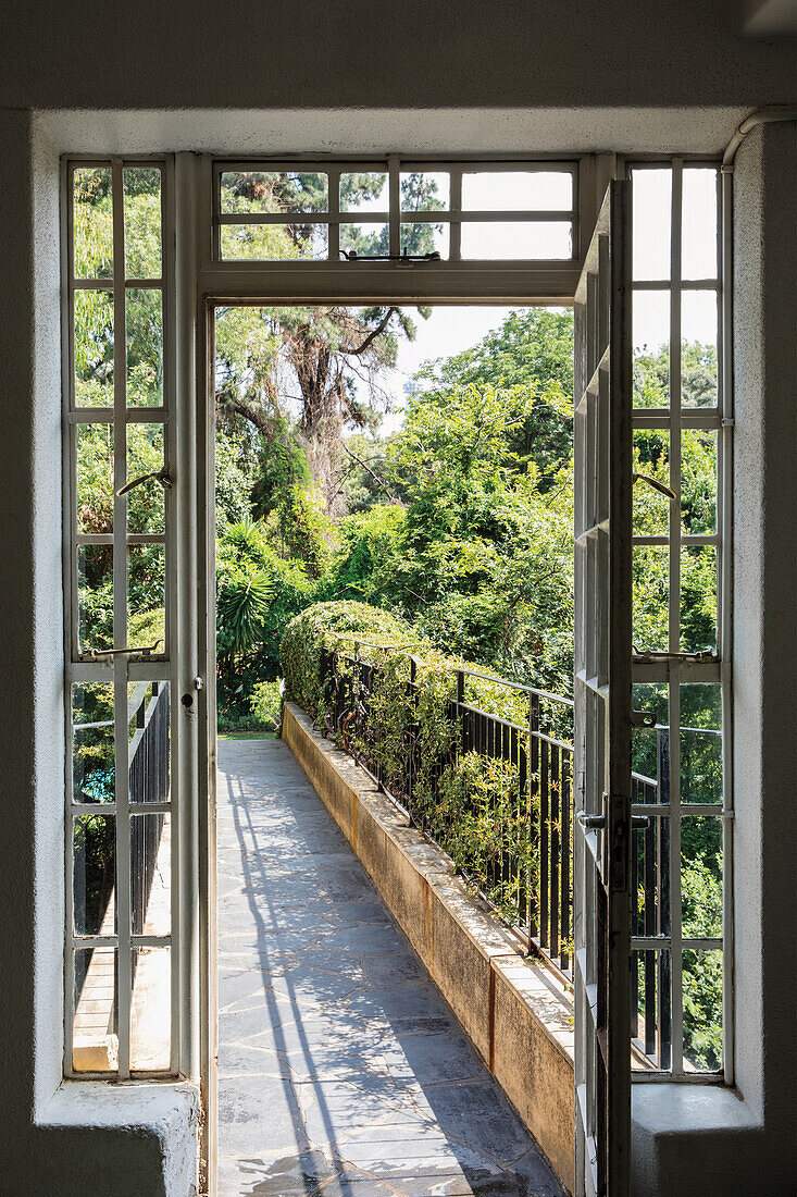 View through the open door on bridge with connection to the park