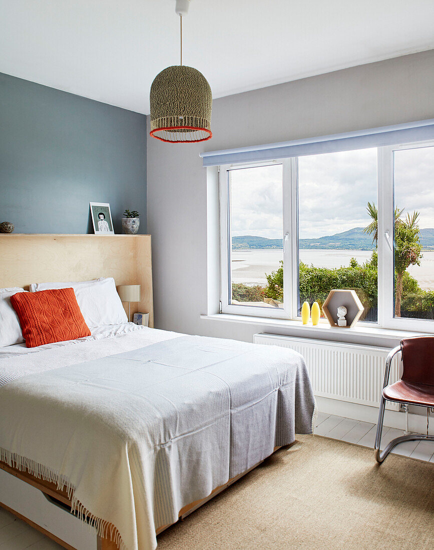 Double bed at window with a view of Lough Gill from Sligo newbuild, Ireland