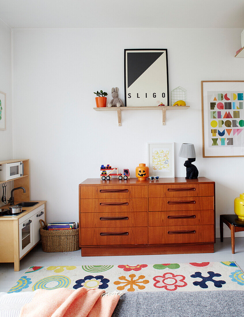 Wooden chest of drawers with shelf and toys in Sligo newbuild, Ireland