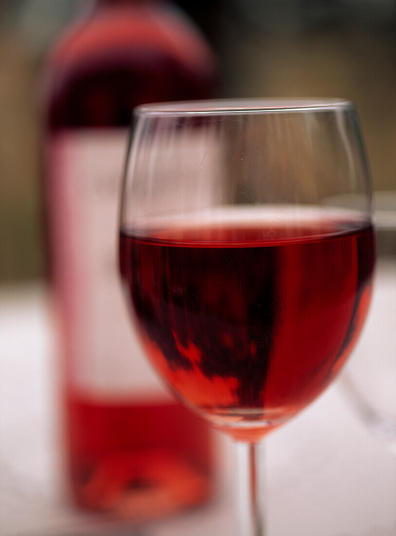 Wine glass and a bottle of red Chateau Carbonel Cotes du Rhone