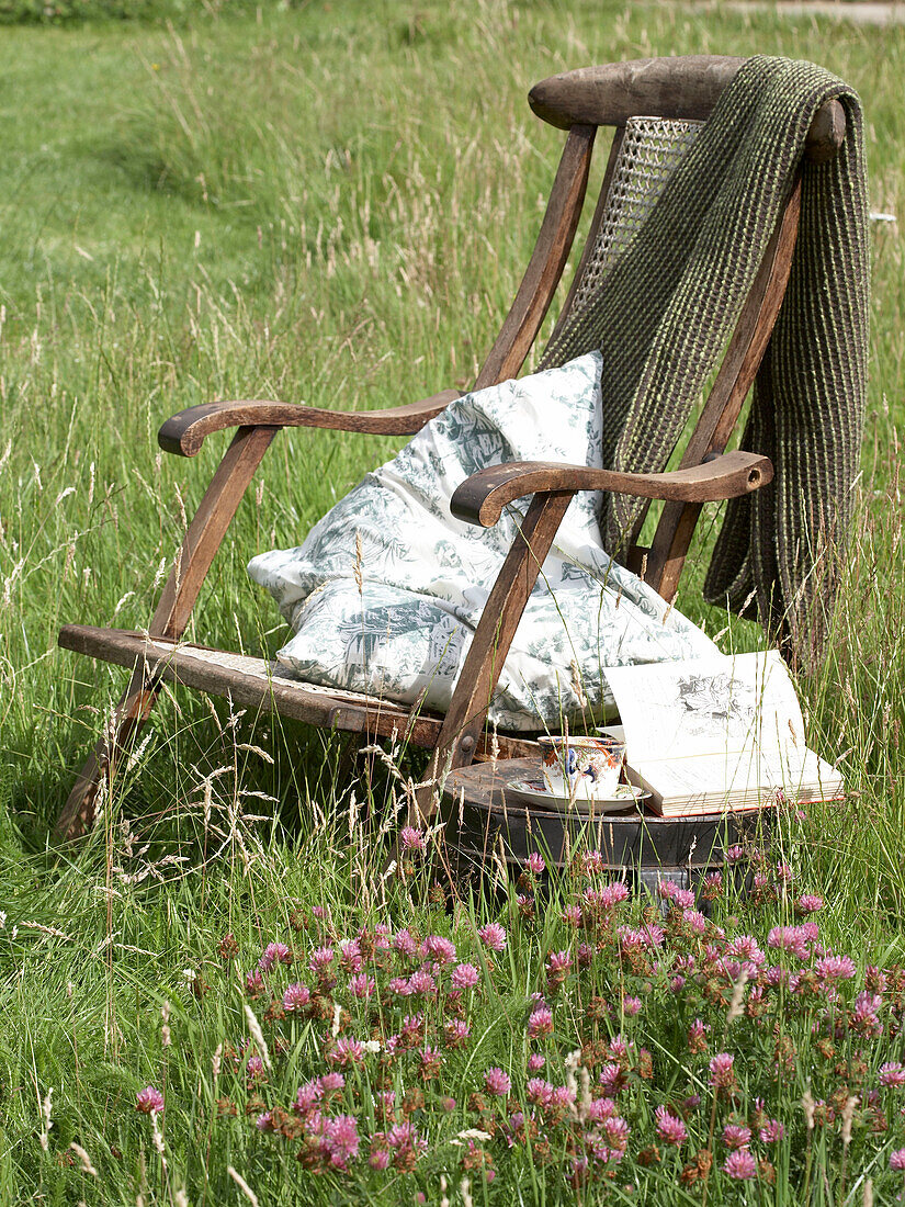 Chair and side table in a meadow