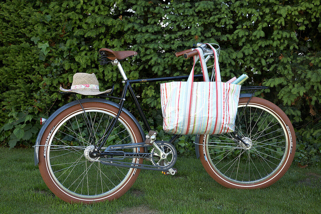 Bicycle with hat and shopping bag
