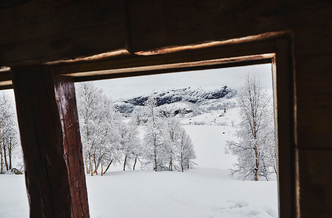 View to snowy mountains from Litlestol a wooden cabin situated in the mountains of Sirdal, Norway