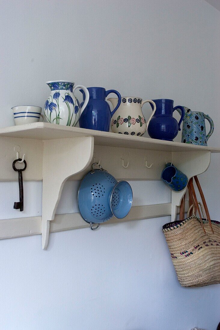 Shelving with a collection of crockery and tableware