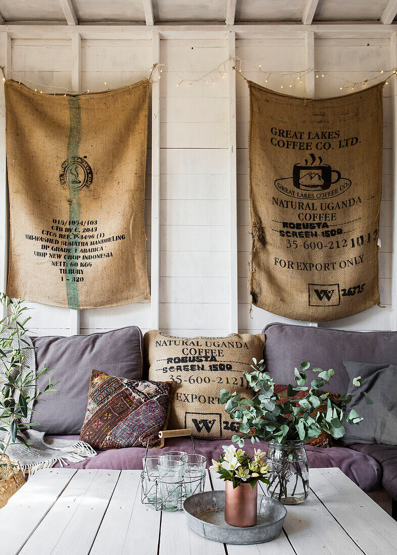 Coffee sacks and sofa with flowers on table in studio shed Guildford Surrey