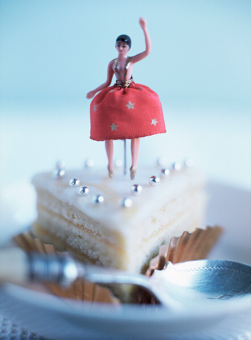 Slice of cake decorated with a figurine