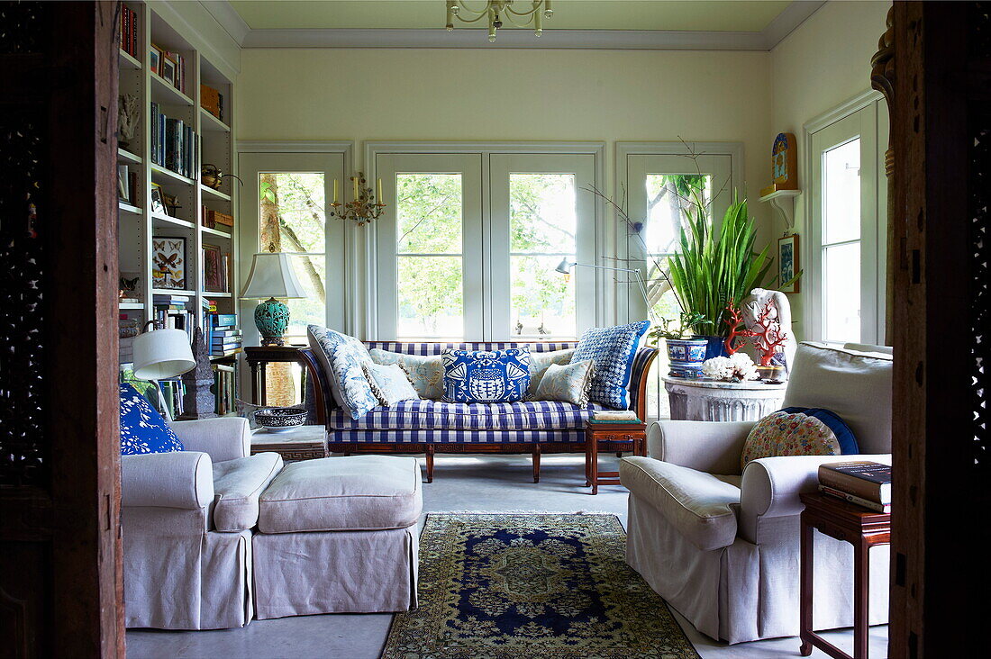 Armchairs with footstool and sofa in Massachusetts living room, New England, USA