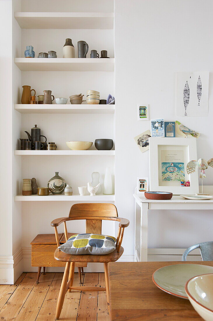 Retro style chair and shelf display in Broadstairs home, Kent, England, UK
