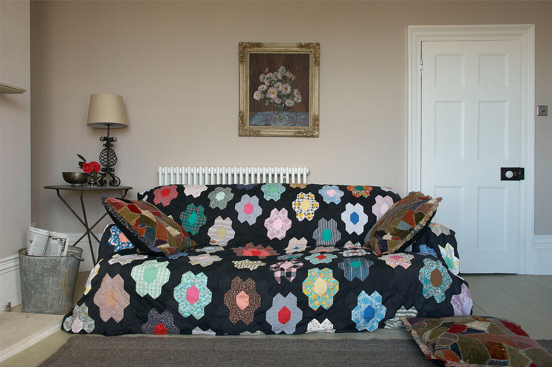 Beautiful patchwork throw over sofa in Hastings beach house England UK