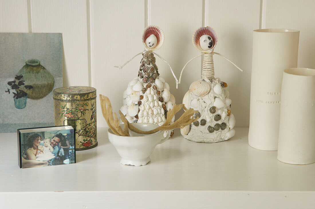 Shell dolls and trinket box on shelf in Canterbury home England UK