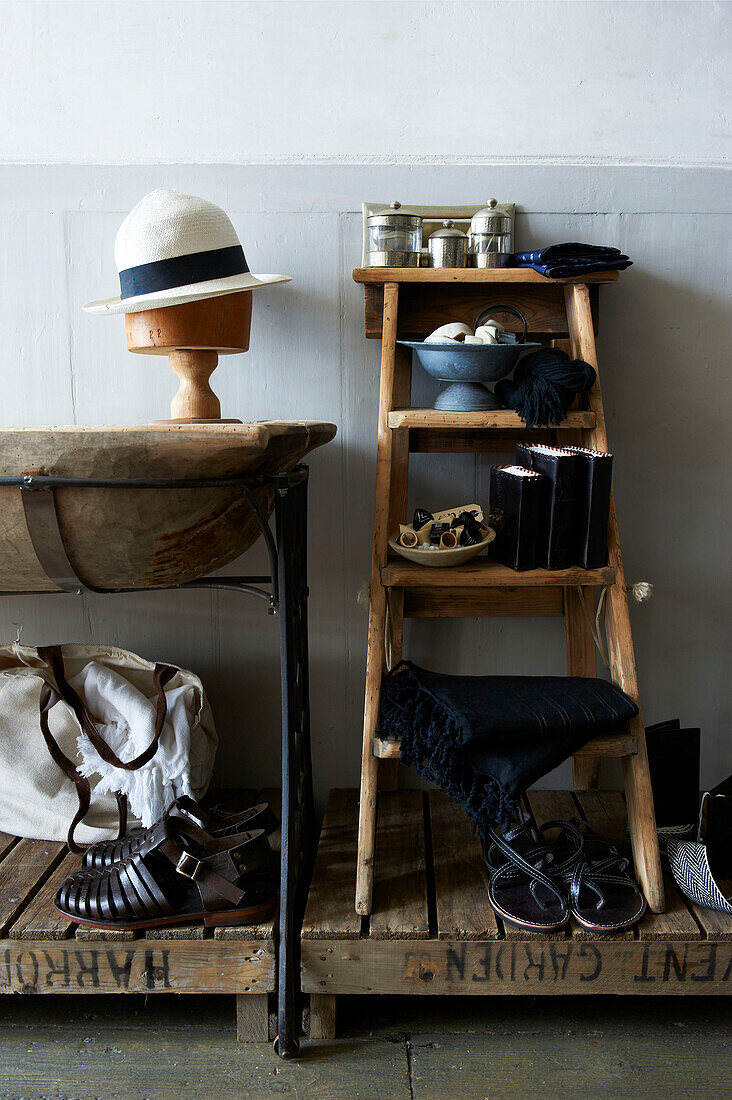Shoes and accessories displayed with step ladder and palette in vintage clothes shop, Hastings, East Sussex, England, UK