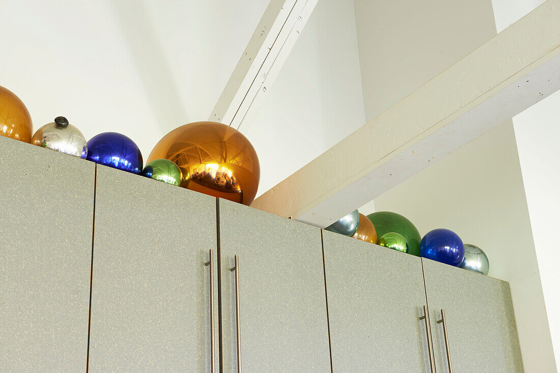 Metallic spheres on top of fitted kitchen unit in Sheffield home, Berkshire County, Massachusetts, United States