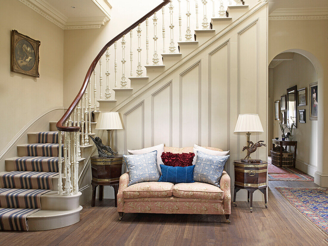 Two seater sofa in spacious entrance hallway of Lincolnshire country house, England, UK