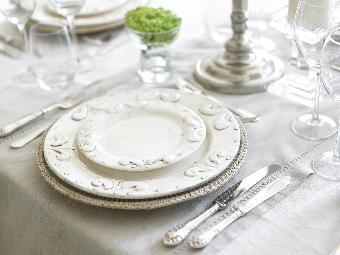 Silver and chinaware place setting in Somerset home England UK