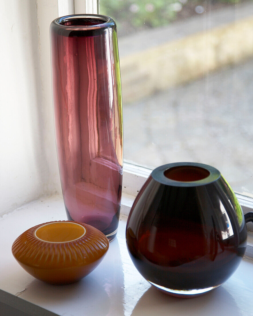 Glass vases on windowsill of Buckinghamshire home England UK