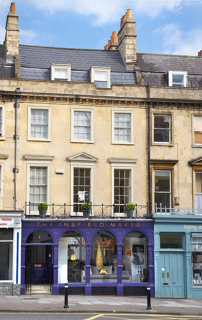 Shop front of terraced townhouses in city of Bath, Somerset, England, UK