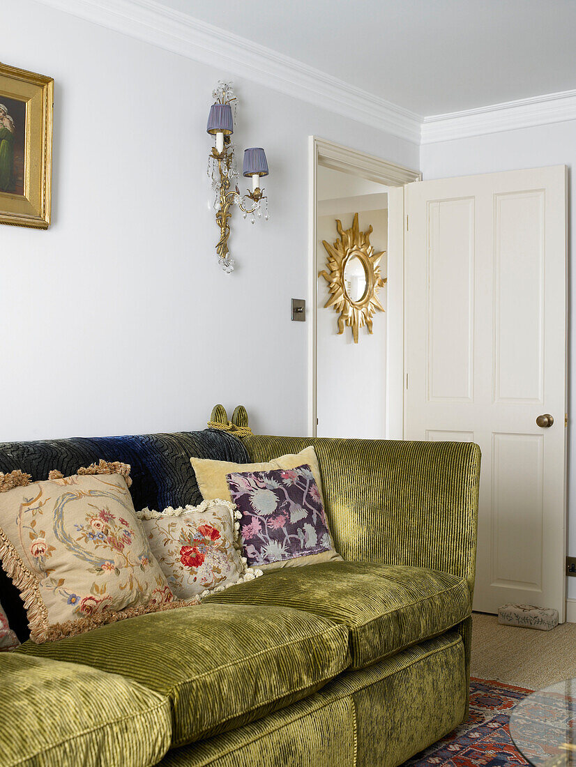 Green corduroy sofa in living room city of Bath Somerset, England, UK