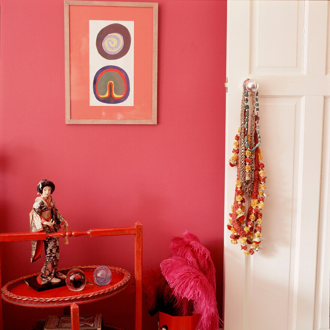 Entrance to woman's bedroom with ornaments and pink walls