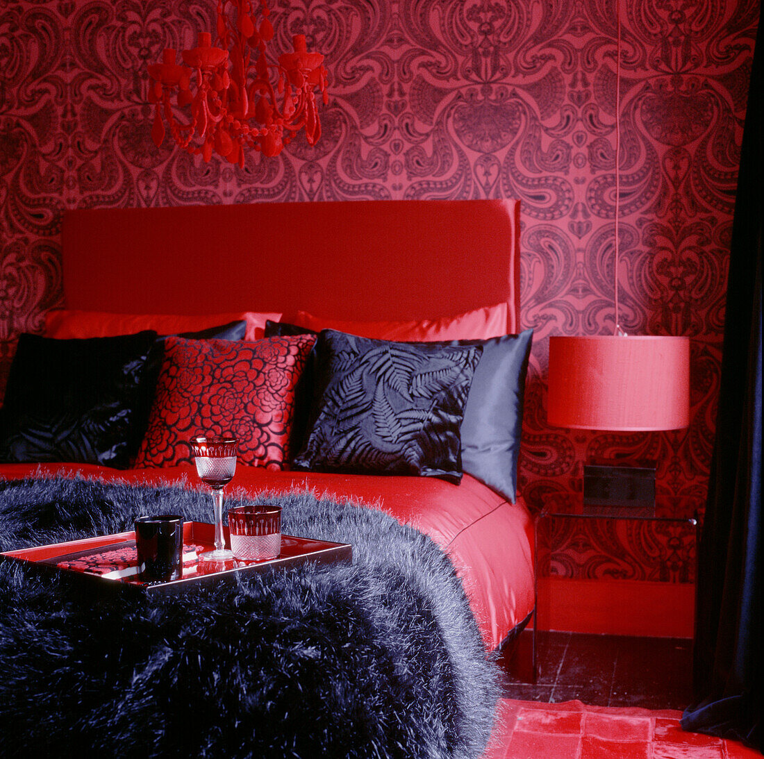 A red and black coordinating bedroom