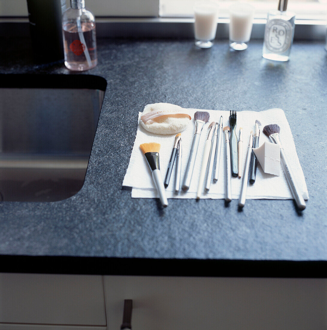 Makeup brushes drying on a kitchen worktop